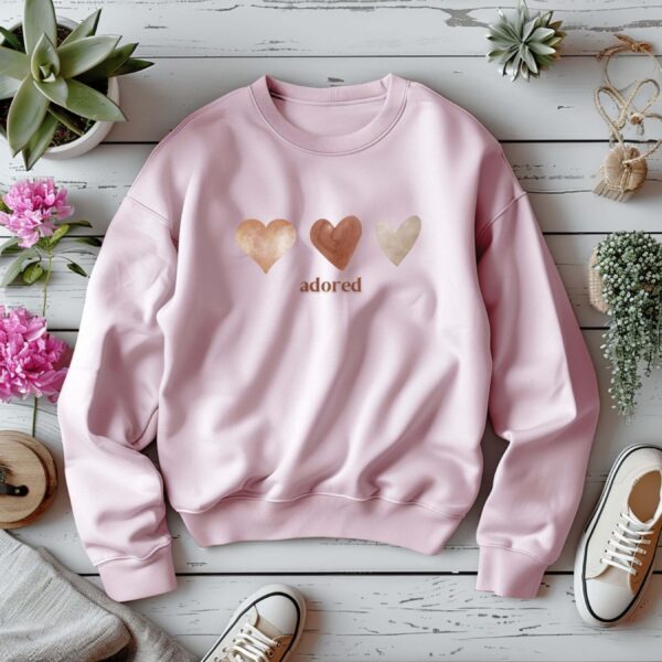 Light Pink sweatshirt with Cute Brown hearts graphic and Adored text– feminine and minimal, from Bhoomkins’ Sweatshirt collection