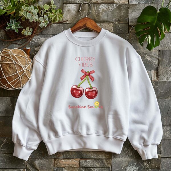White sweatshirt with Cute Cherry Bow Print and Cherry Vibes text– feminine and minimal, from Bhoomkins’ Cherry collection