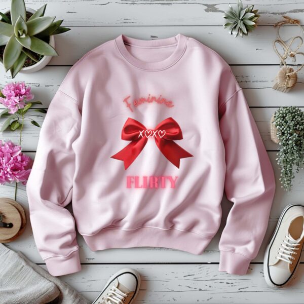 Light Pink sweatshirt with Red Bow Print & Flirty & Feminine text– feminine and minimal, from Bhoomkins’ Coquette collection