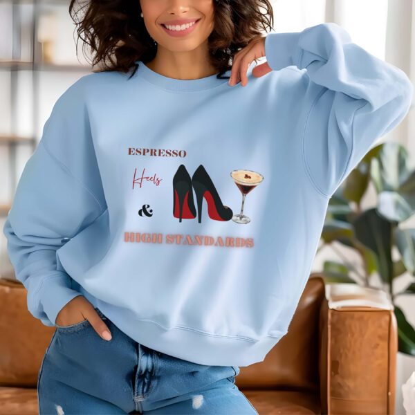 Light Blue sweatshirt with Black Stilletos, Espresso Print & Espresso, Heels & High Standards Text– feminine and minimal, from Bhoomkins’ Boldly Feminine collection