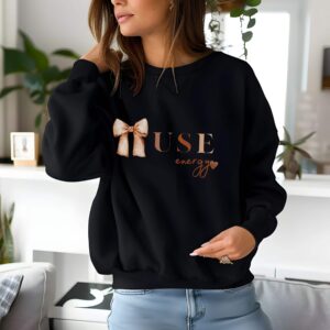 Black sweatshirt with Cute Brown Bow and Muse Energy text – feminine and minimal, from Bhoomkins’ Coquette collection