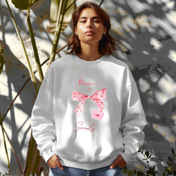 White sweatshirt with Pink Bow & Love Letter and Ribbons & Secrets text– feminine and minimal, from Bhoomkins’ Coquette collection