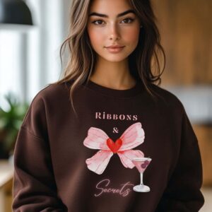 Dark Chocolate sweatshirt with romantic bow print and ribbons and secrets text – feminine and minimal, from Bhoomkins’ Coquette collection