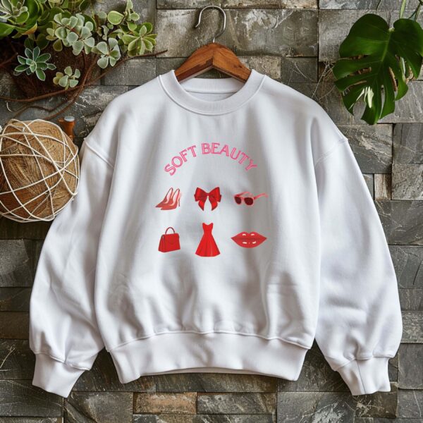 White sweatshirt with GRWM elements in red and Soft Beauty text– feminine and minimal, from Bhoomkins’ Coquette collection