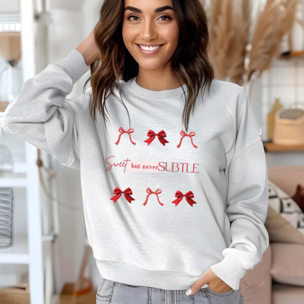 Ash sweatshirt with red bows print and Sweet but never subtle text– feminine and minimal, from Bhoomkins’ Coquette collection