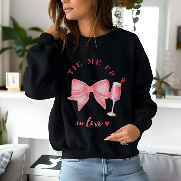 Black sweatshirt with checkered pink bow and mocktail Print and Tie me up in love text – feminine and minimal, from Bhoomkins’ Coquette collection