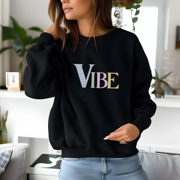 Black sweatshirt with pastel checked letters spelled as Vibe – feminine and minimal, from Bhoomkins’ Sweatshirts collection
