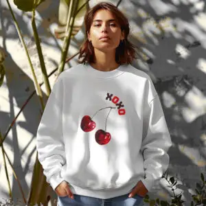 White cozy sweatshirt with cute cherry print and XOXO text– feminine and minimal, from Bhoomkins’ cherry collection
